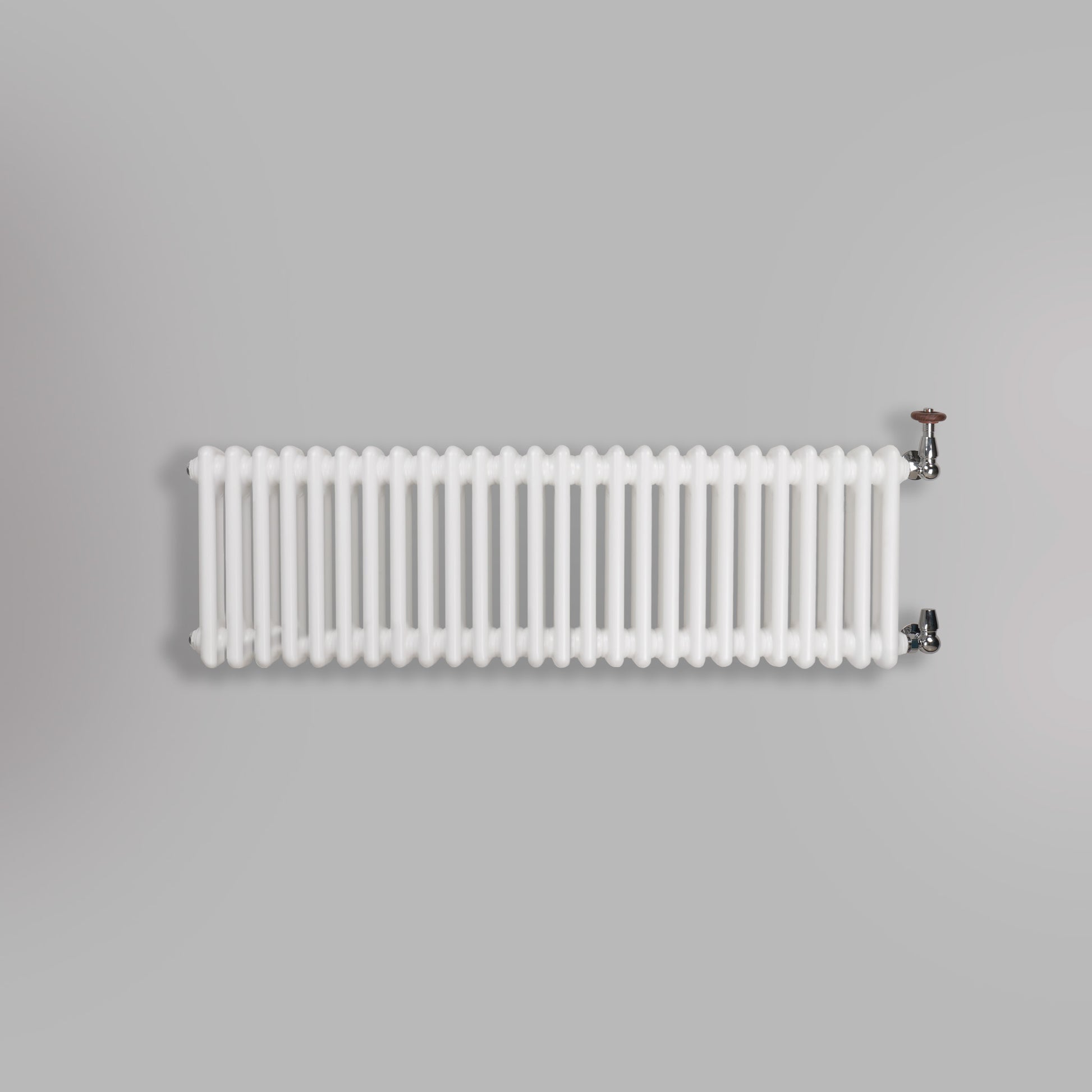 Grzejnik Dekoracyjny Żeberkowy - 3 Kolumnowy Biały - 426x1190mm, gładkie tło firmy Empire